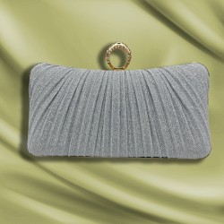 silver Pleats holding a party bag